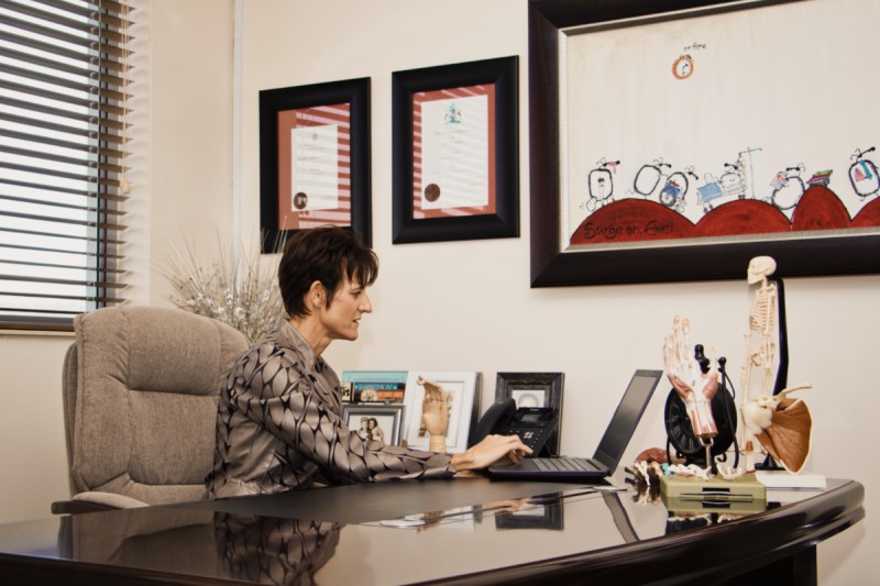 Dr Odette Koch doing admin work at her desk