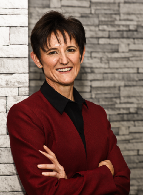 Dr Odette Koch standing in her orthopaedic office